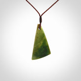 This is a lovely New Zealand Flower Jade, pounamu drop pendant. Hand carved for us by Kyohei Noguchi. It is bound with an adjustable brown coloured cord which is length adjustable. Free worldwide shipping.